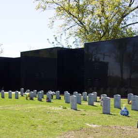 Black wall with headstones